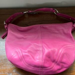 Hot pink Coach bag, has received some love